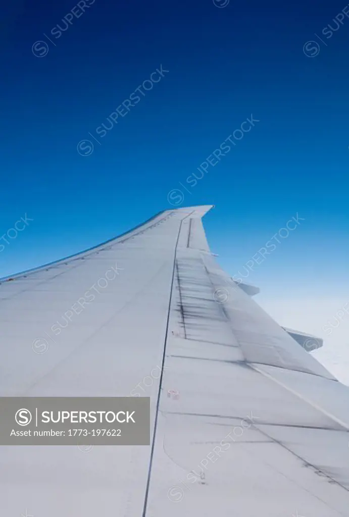Airplane wing seen from inside commercial jet