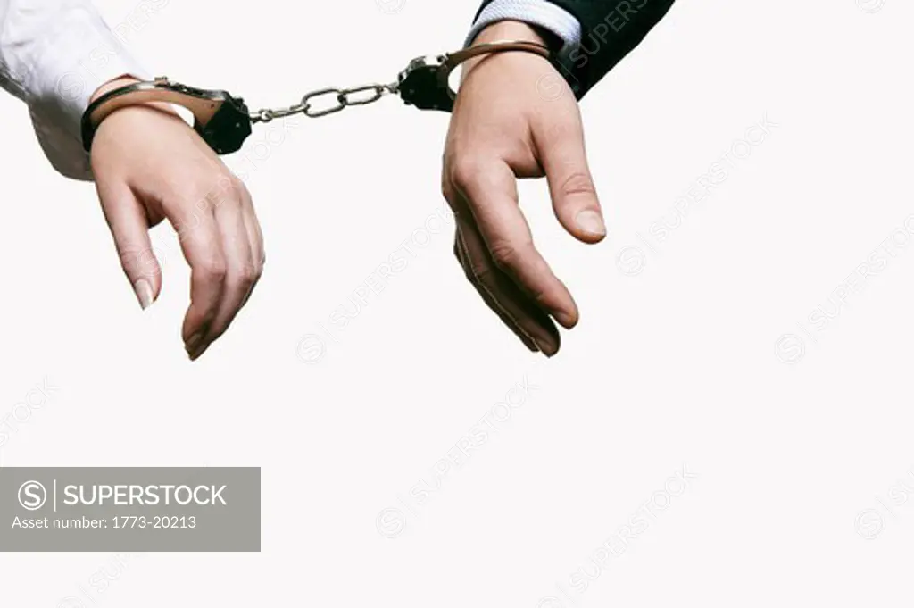 close up of woman and man handcuffed together
