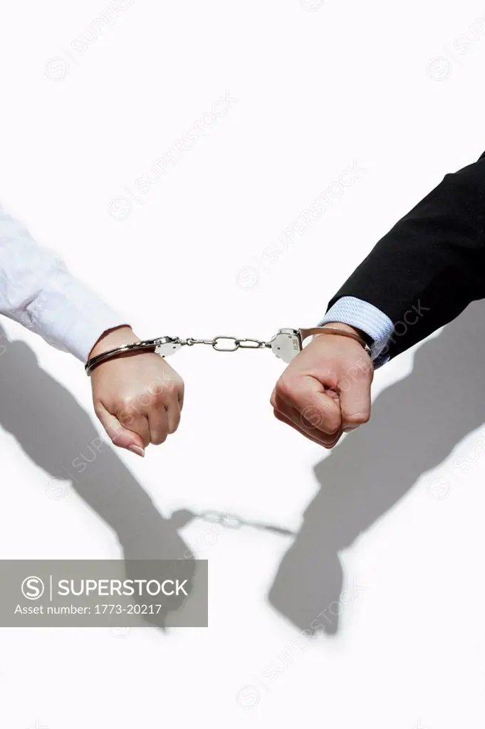 Close up of woman and man handcuffed together
