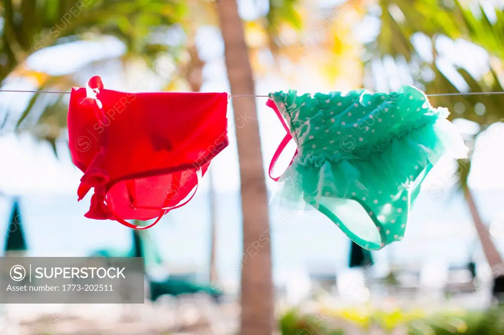 Swimsuits hanging on clothesline