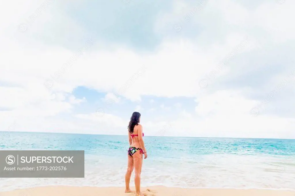 Woman wearing bikini on beach, St Maarten, Netherlands
