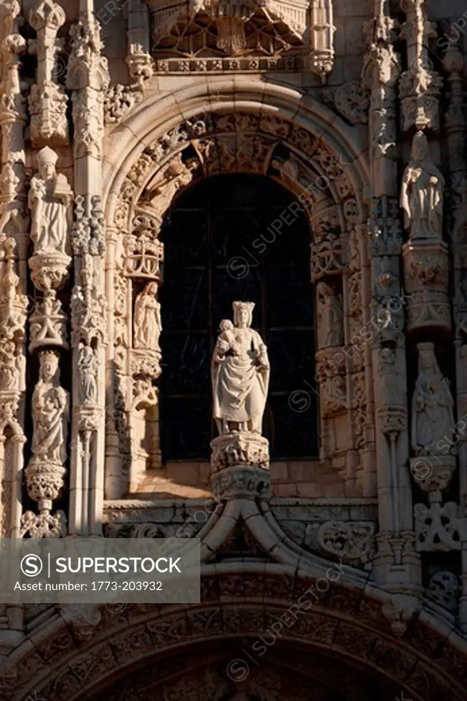 A statue above the main entrance to Jeronimos Monastery in the early hours of the morning in Lisbon, Portugal. Jeronimoes Monastery is listed as an UNECSO Heritage Site,