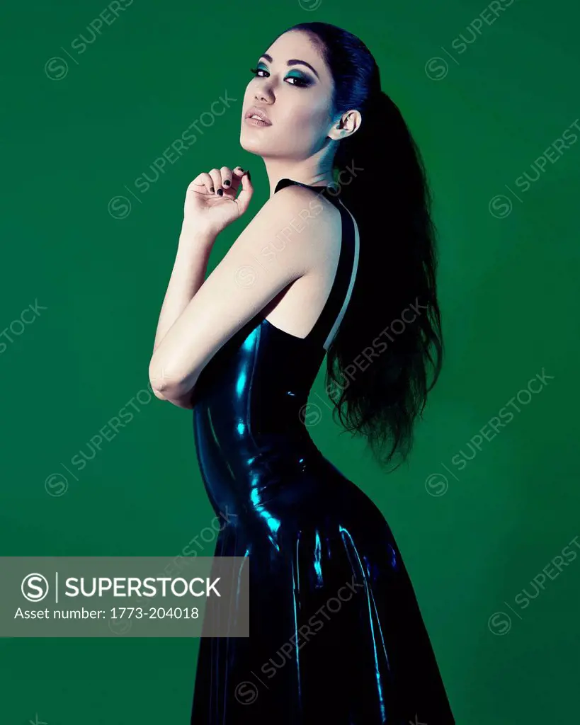 Young woman wearing black plastic dress