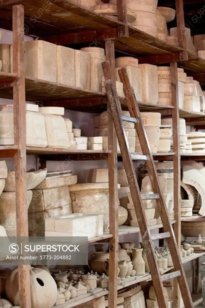 Shelves of clay moulds at Fabrica Ceramica Fundada, an old ceramics factory still working today, in Lisbon, Portugal