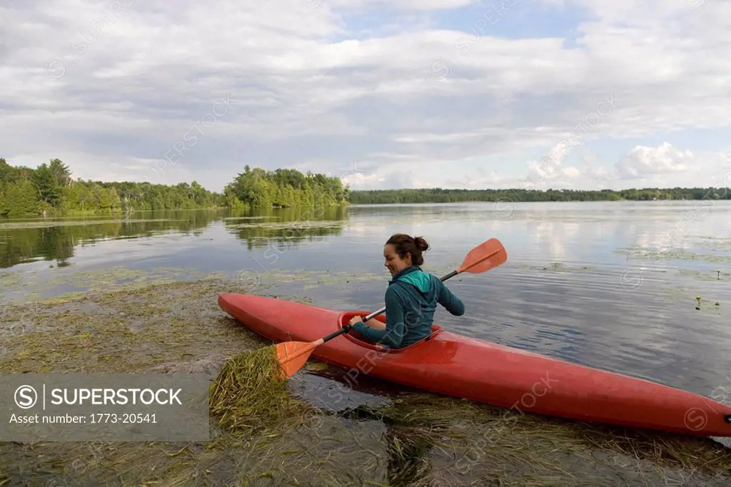 Woman canoeing on lake