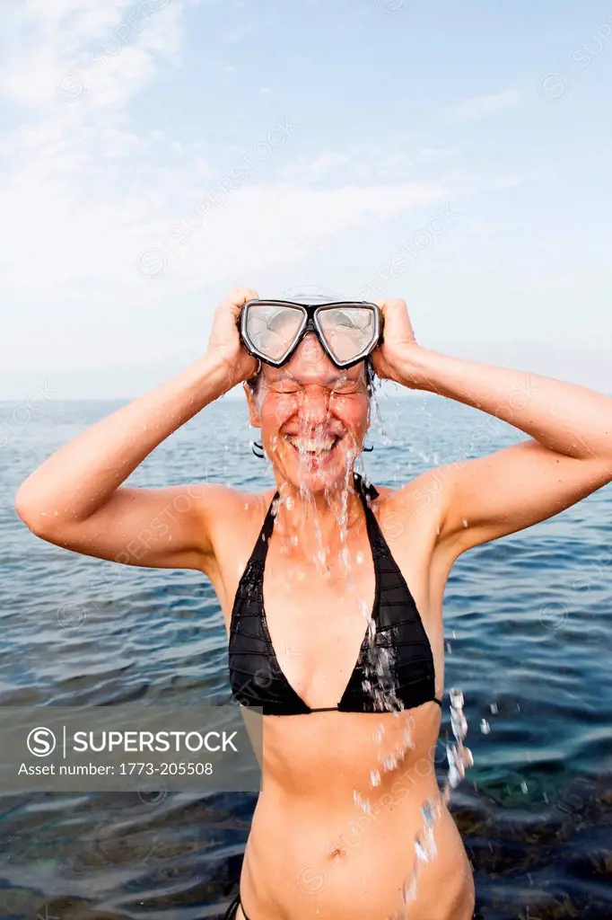 Woman in sea with diving mask