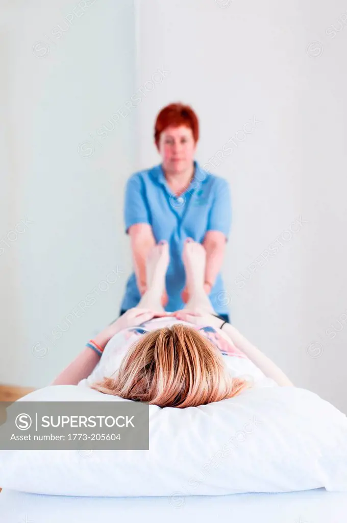 Woman giving massage treatment