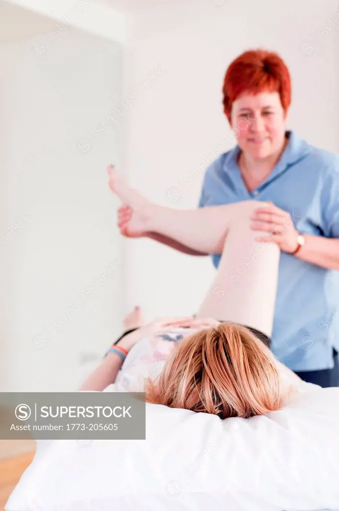 Woman giving massage treatment