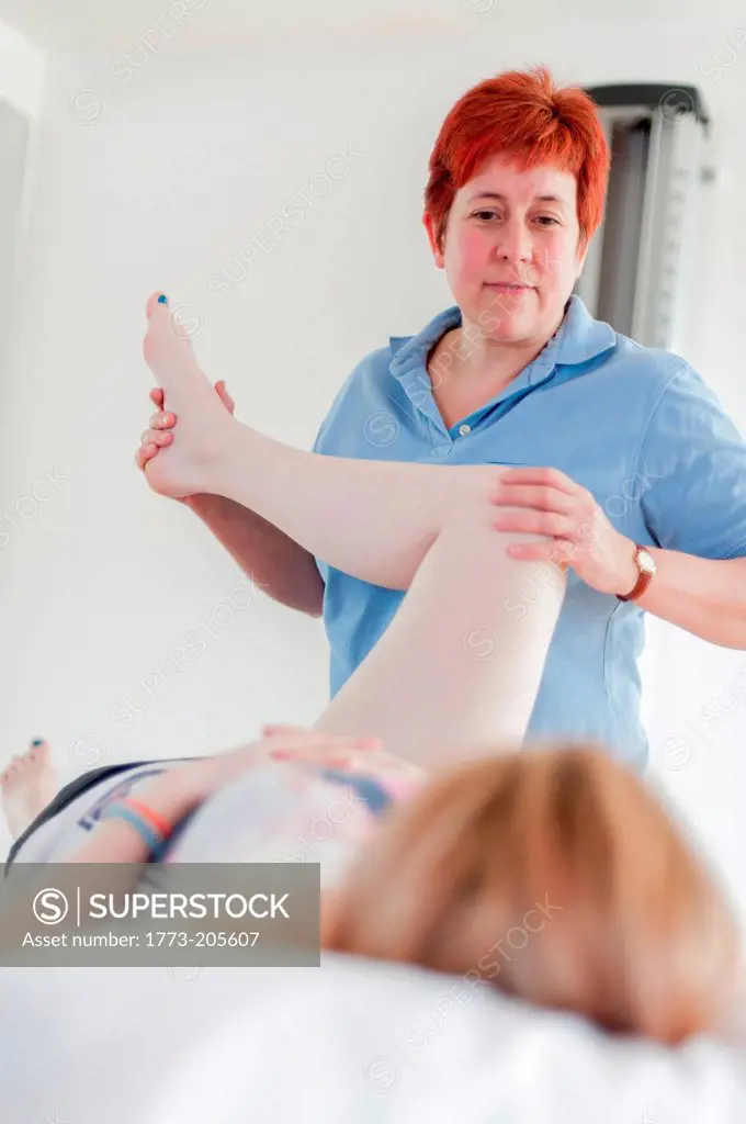 Woman giving physio treatment