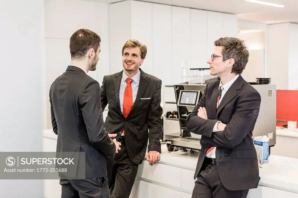 Businesspeople standing in cafeteria