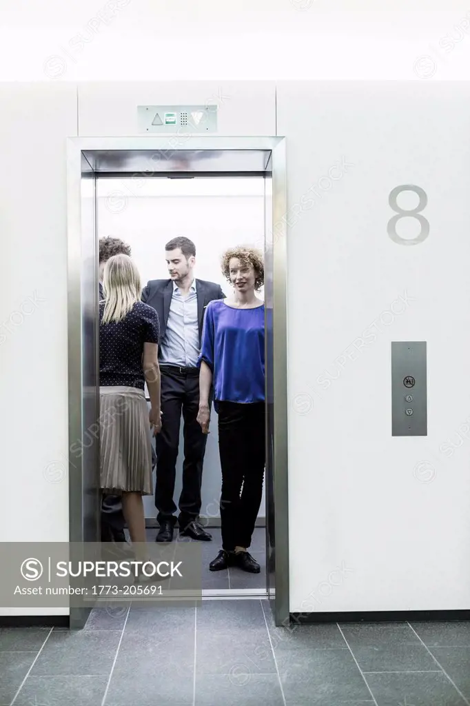 Businesspeople standing in lift