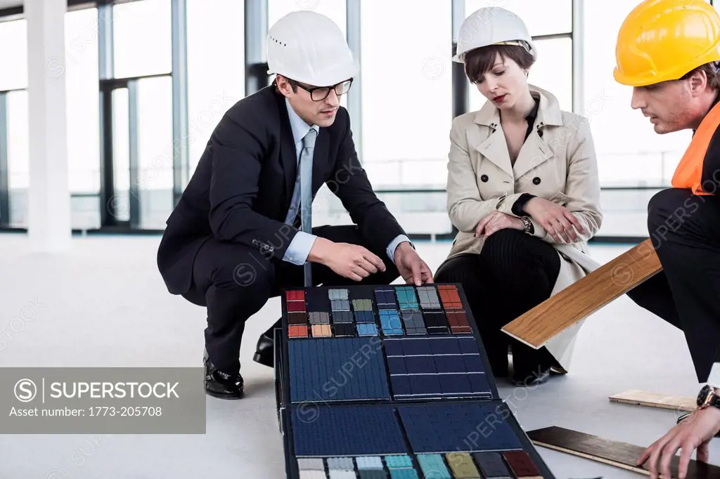 Architects discussing flooring samples