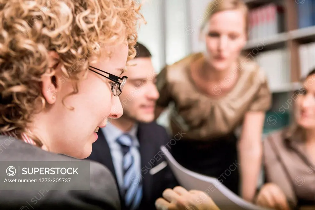 Female lawyer with blonde curly hair in meeting