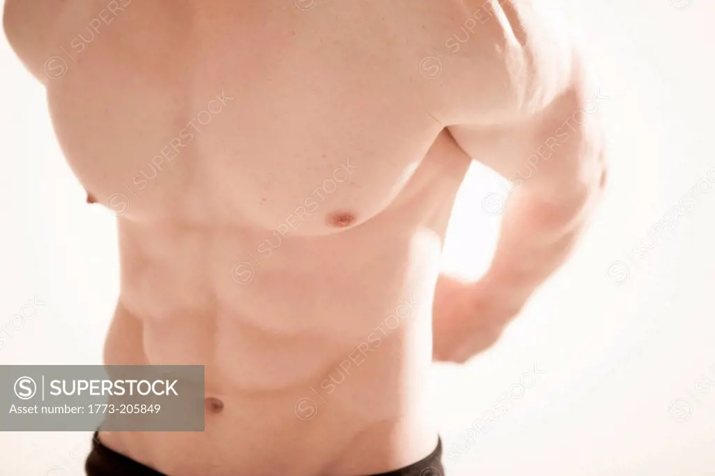 Mid section of man's body showing pectoral muscle
