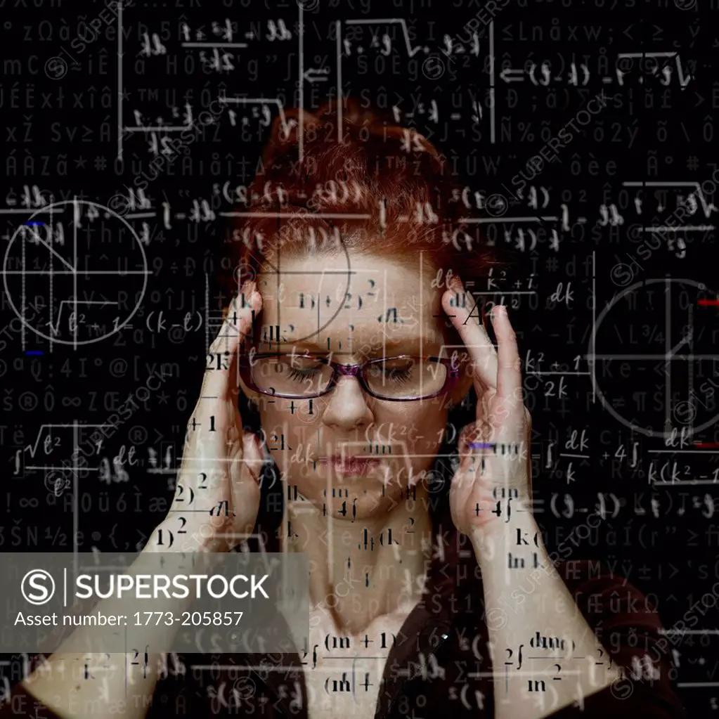 Woman concentrating on solving mathematical equation