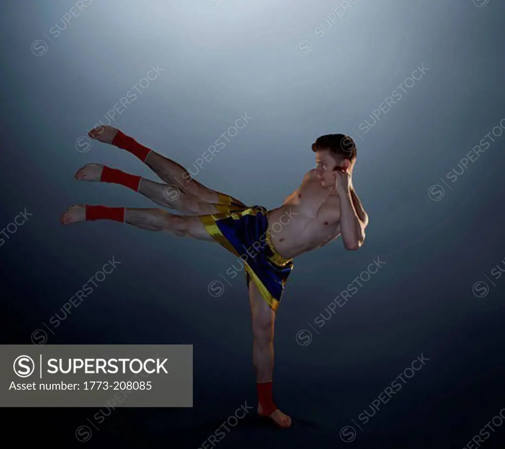Multiple exposure of young male kick boxer
