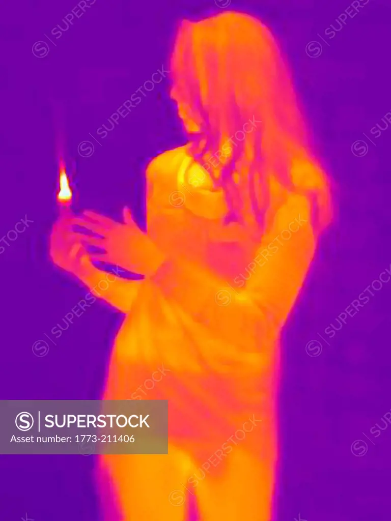 Young woman holding a candle