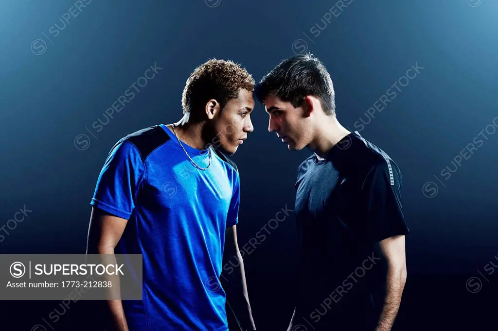 Portrait of two male soccer players head to head