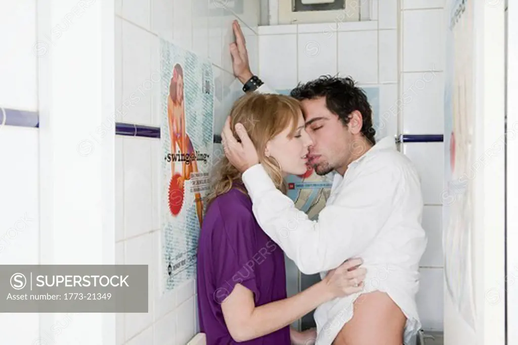 couple in toilet, kissing