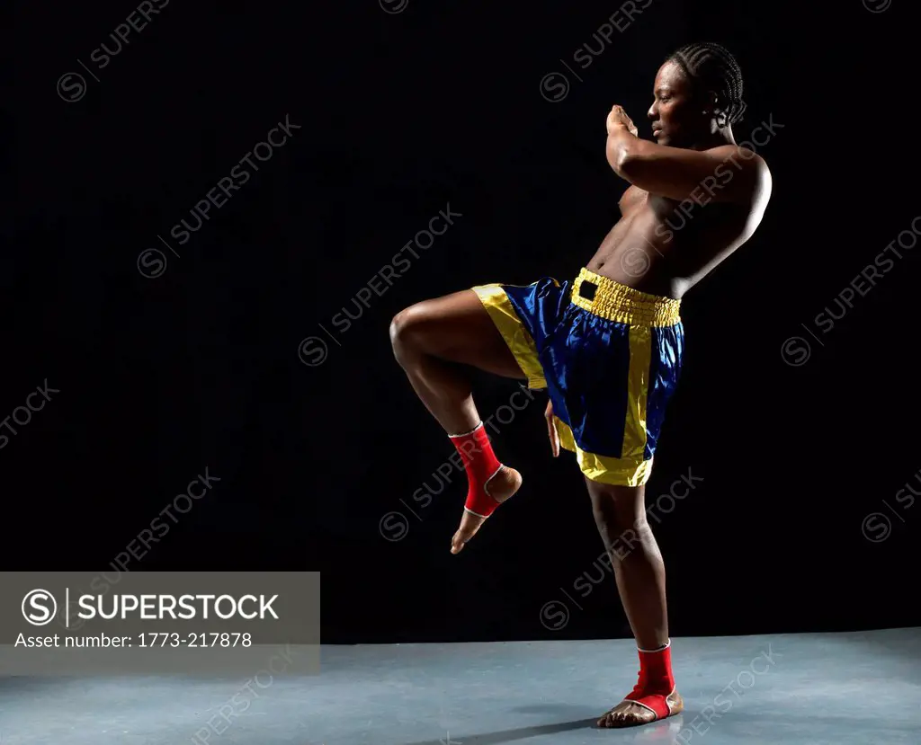 Studio shot of kick boxer