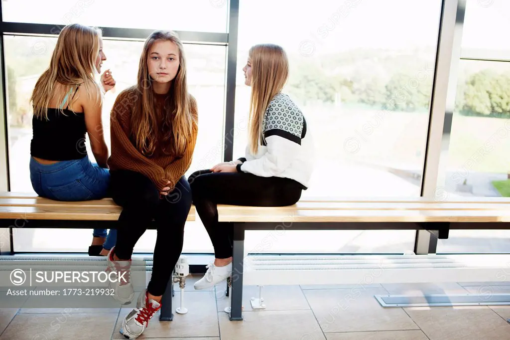 Isolated teenage schoolgirl in corridor
