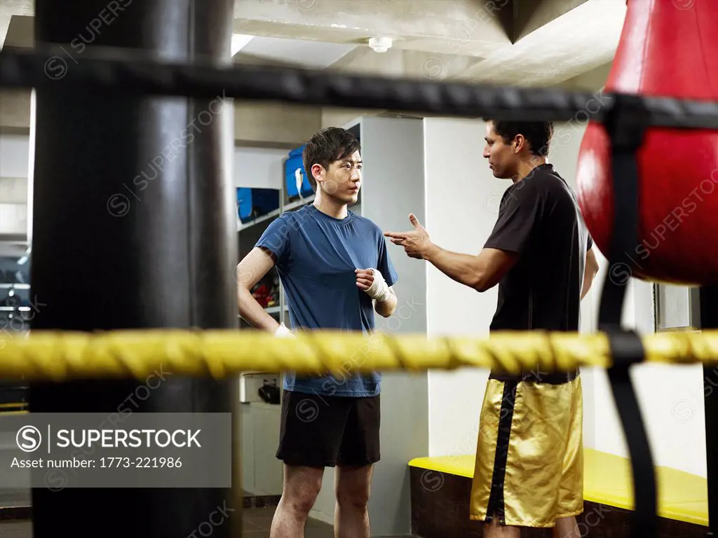 Boxers having conversation in changing room
