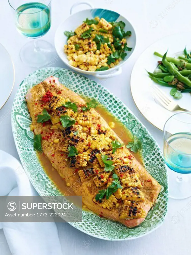 Dish of baked salmon with a corn lime salsa