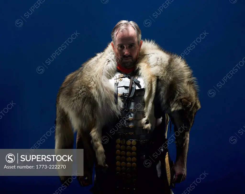 Studio portrait of gladiator wearing wolf fur