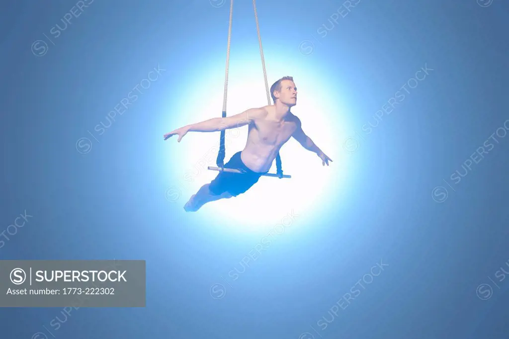 Man balancing on trapeze