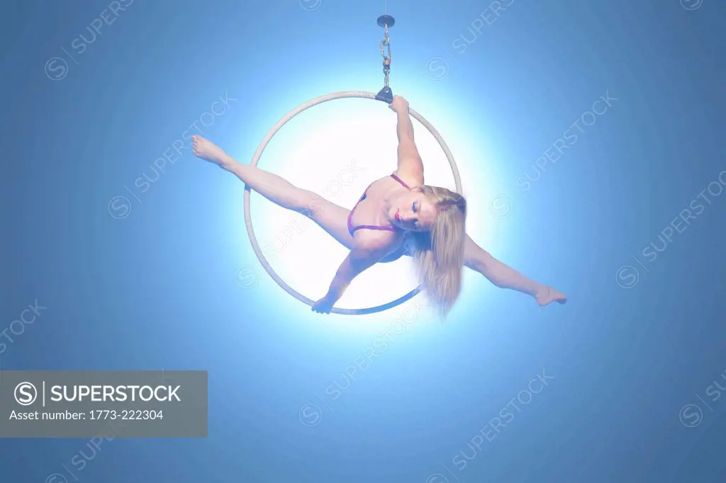 Female dancer balancing on hoop