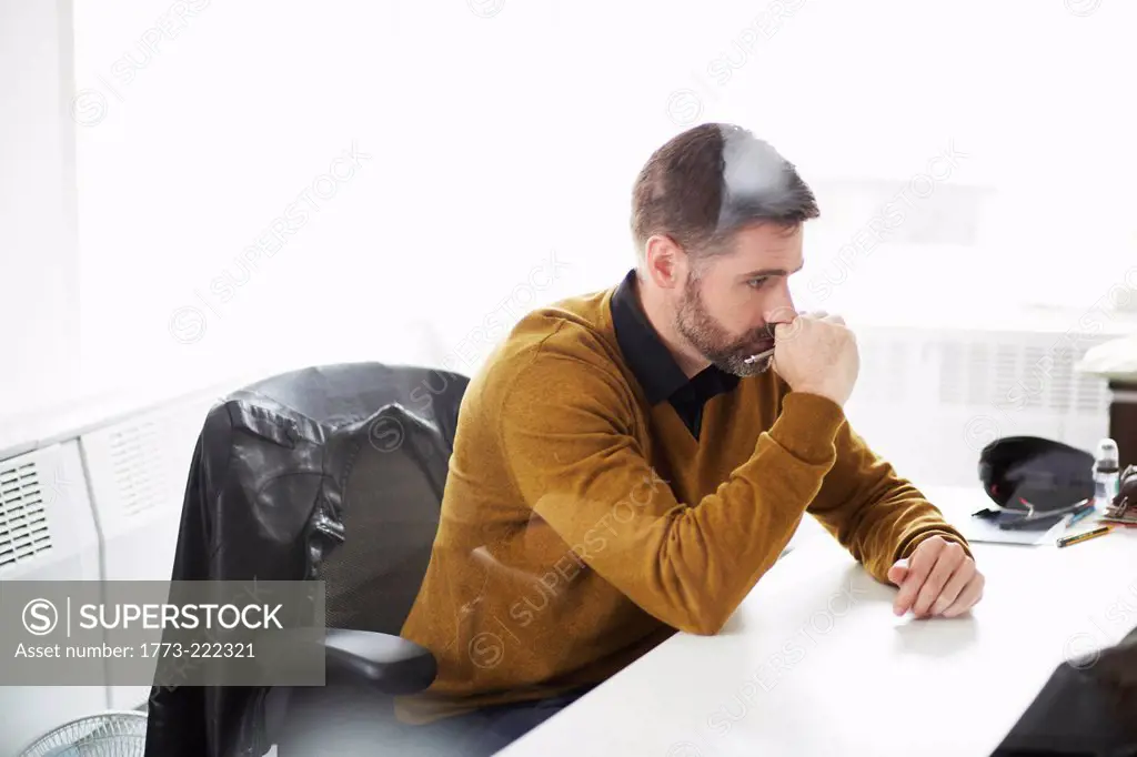 Casual businessman working at desk