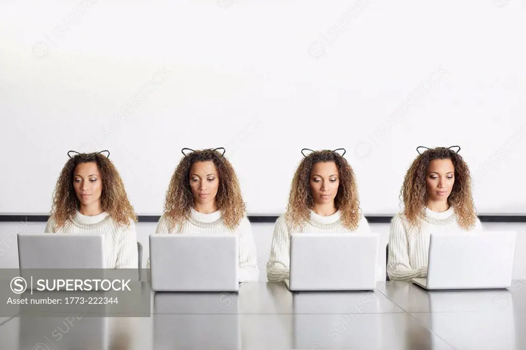Businesswomen wearing ears using laptops