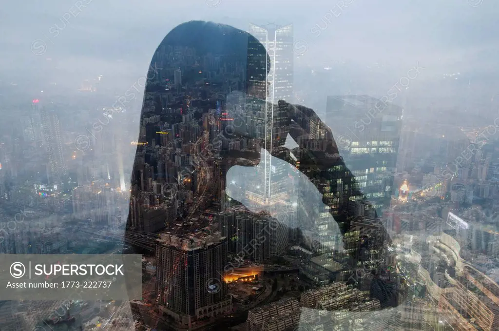 Businesswoman using smartphone and Hong Kong cityscape, composite image
