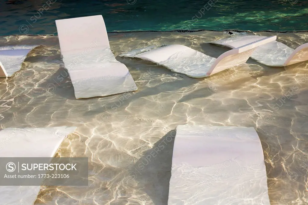 Empty loungers submerged in swimming pool, Las vegas, Nevada, USA