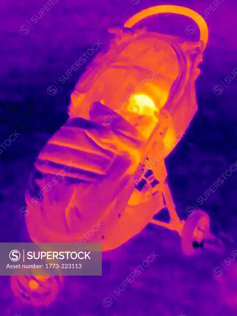 Thermal image of six month baby boy n baby carriage