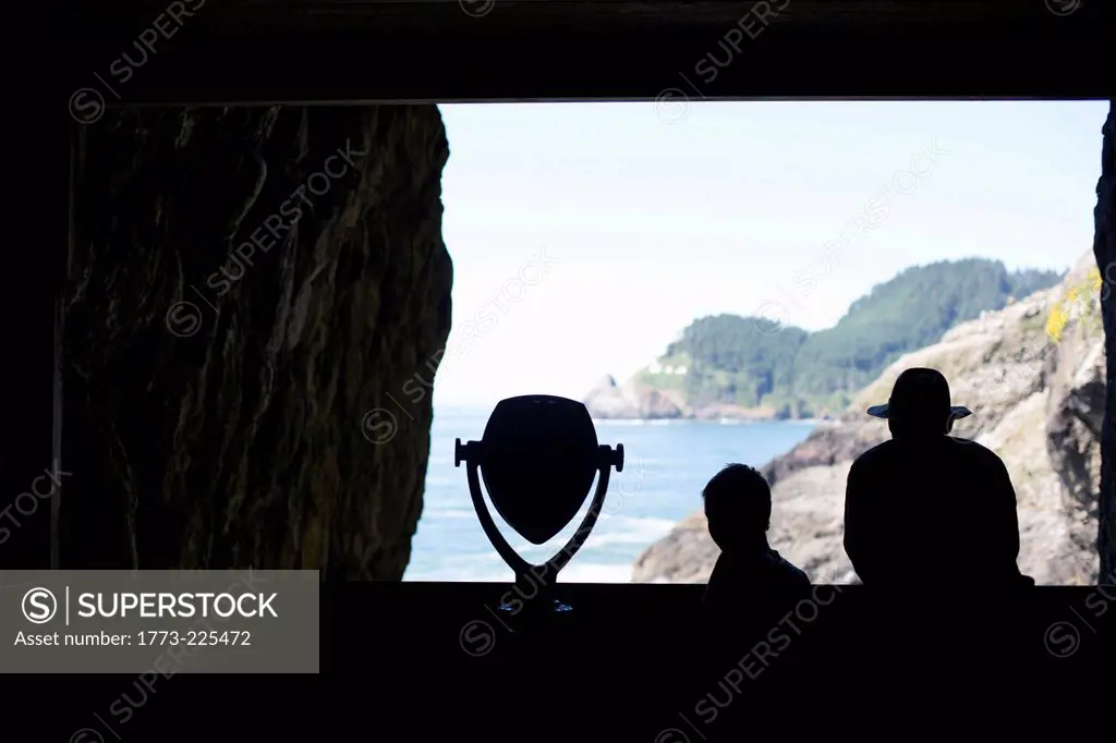 Father and son in Sea Lion Caves, Oregon, USA