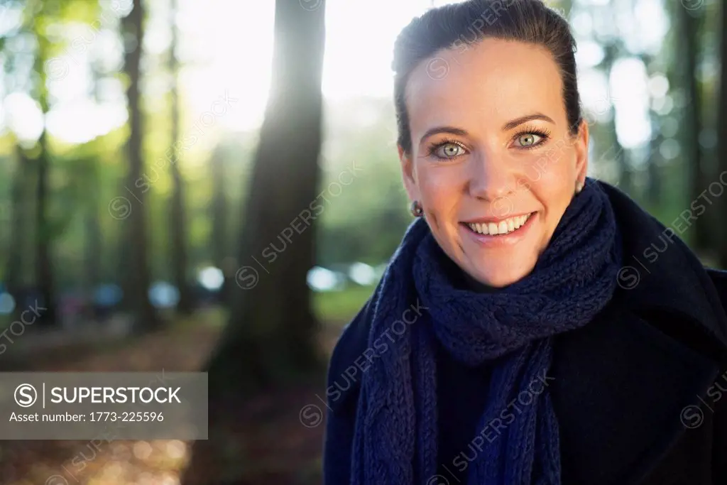 Portrait of mid adult woman in woodland park