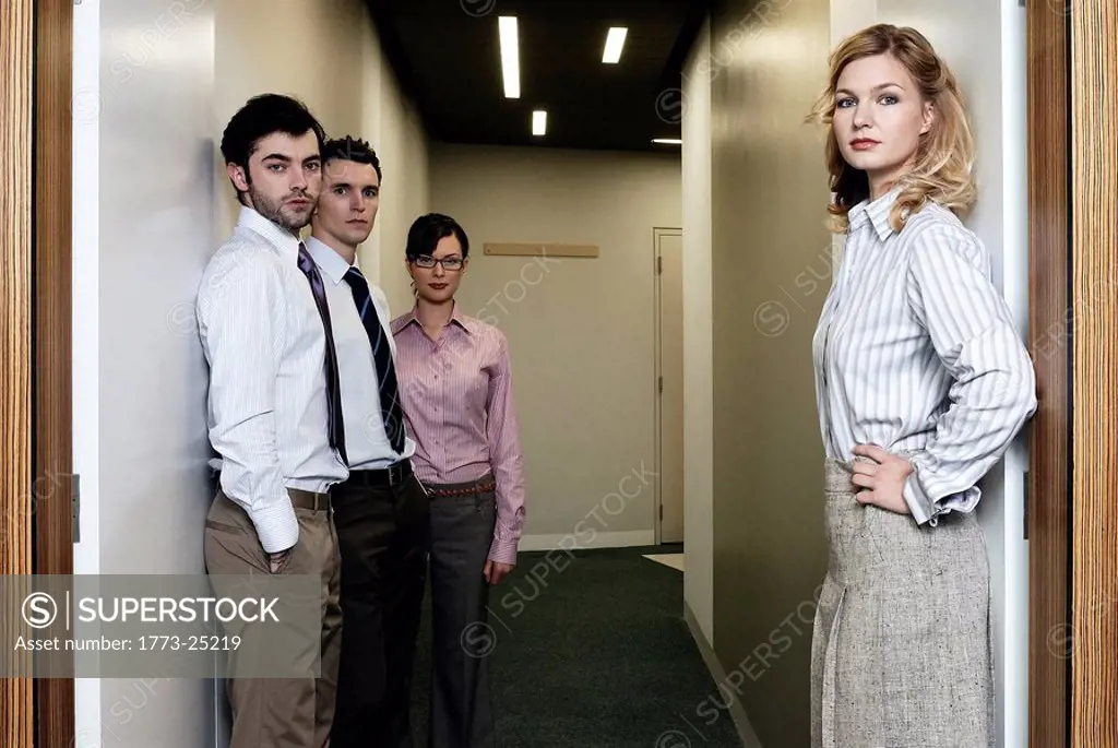 2 Women and 2 men in an office corridor