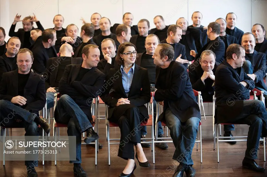 businesswoman surrounded by man 25 times