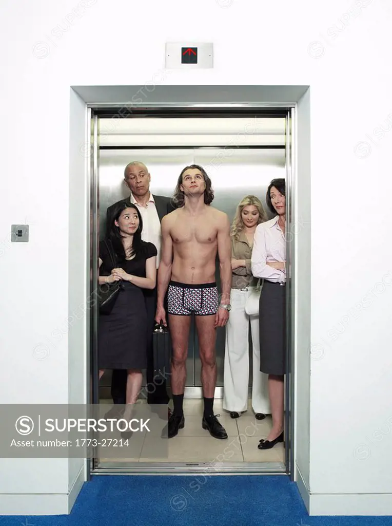 man in underwear in busy lift