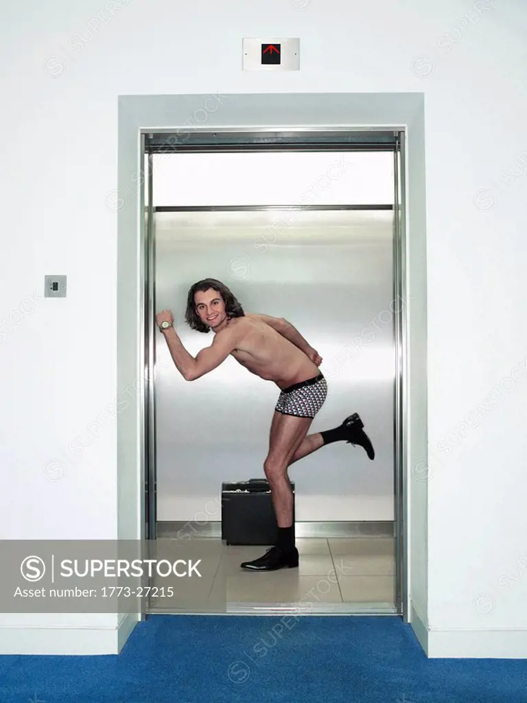 man in underwear in a lift