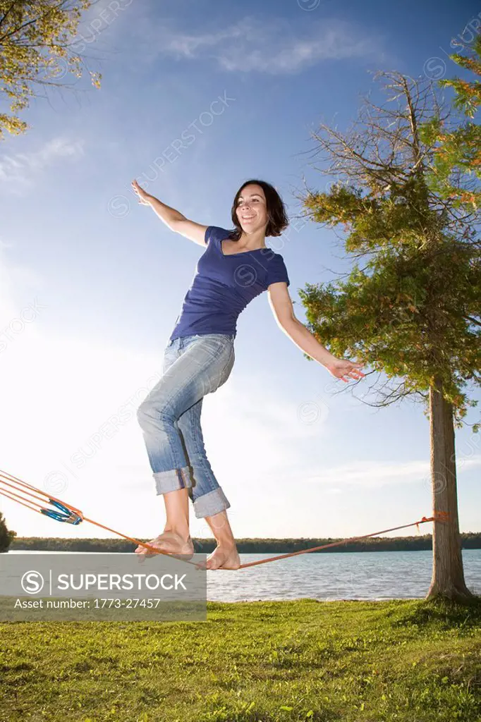 Woman balancing on slackline