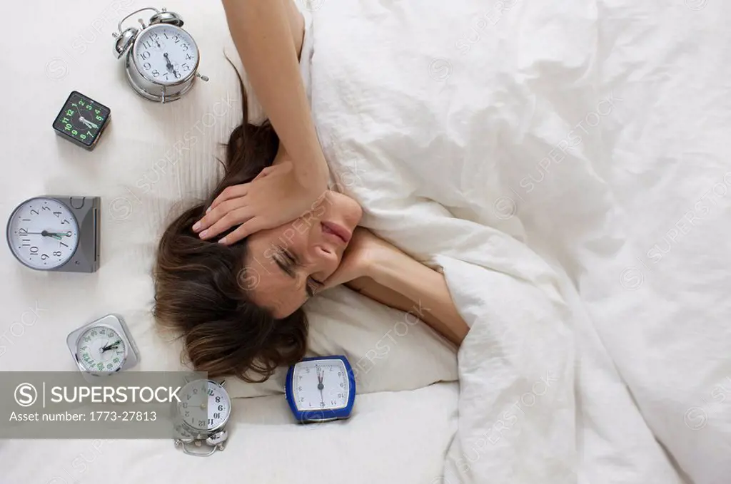 young woman upset about alarm_clock