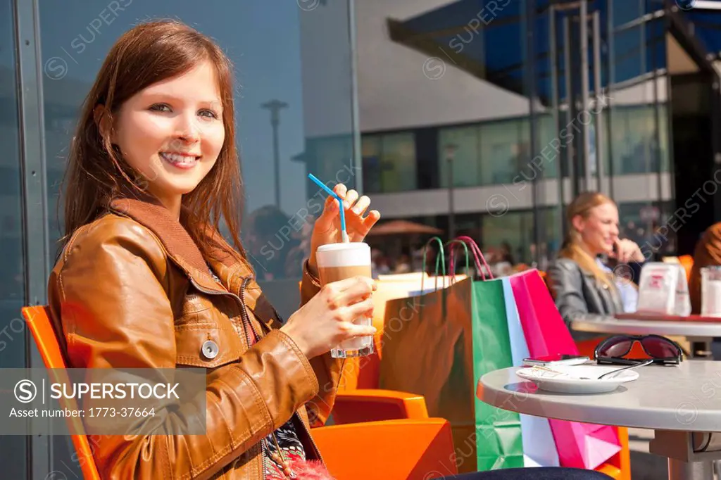 Girl enjoying coffee after shopping