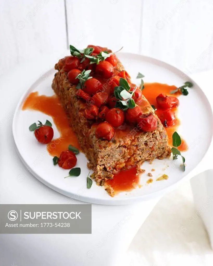 Plate of meatloaf with tomatoes
