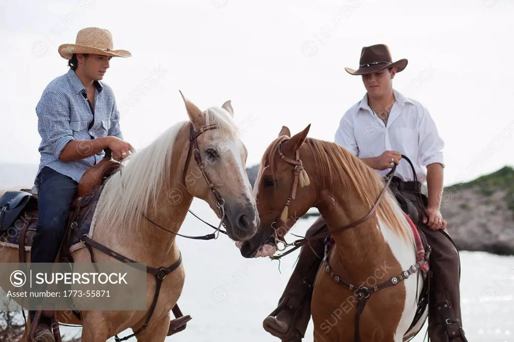 men riding horses