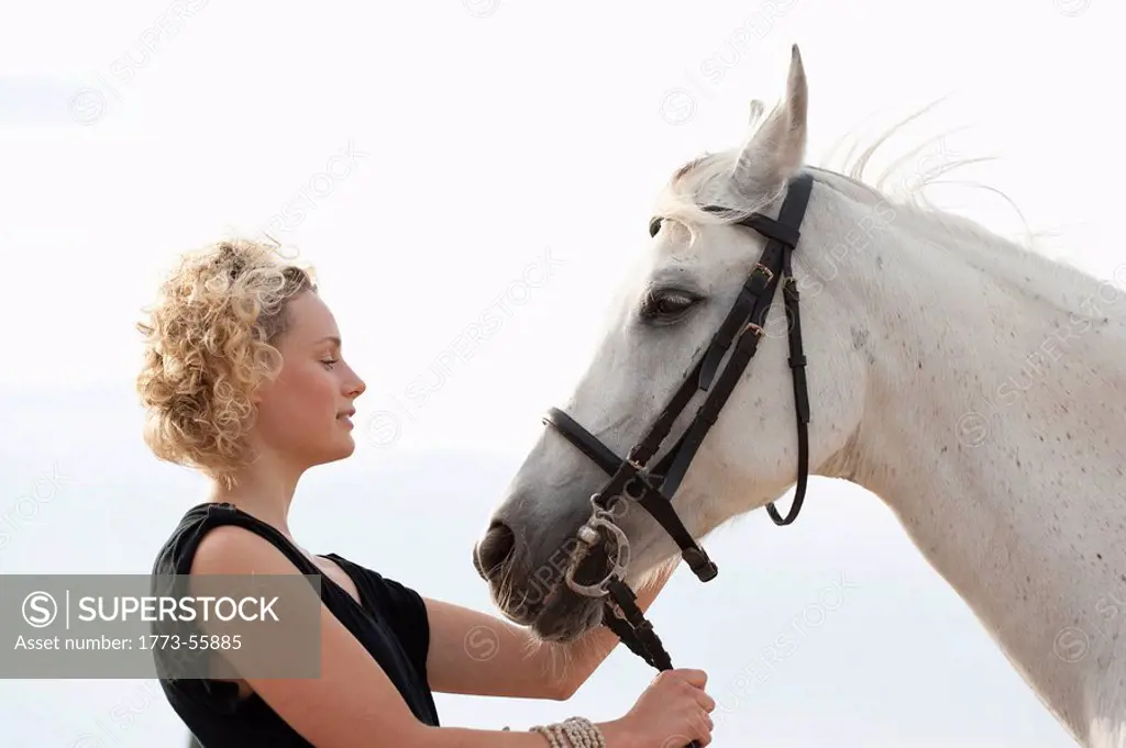 woman and man riding horse together