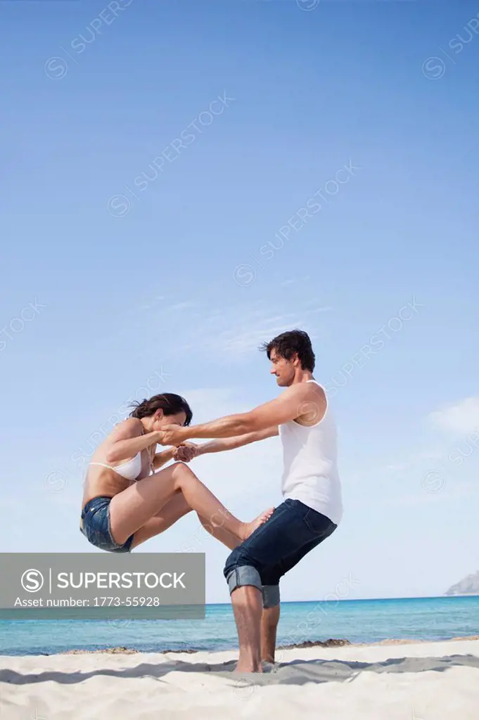 couple on beach playing