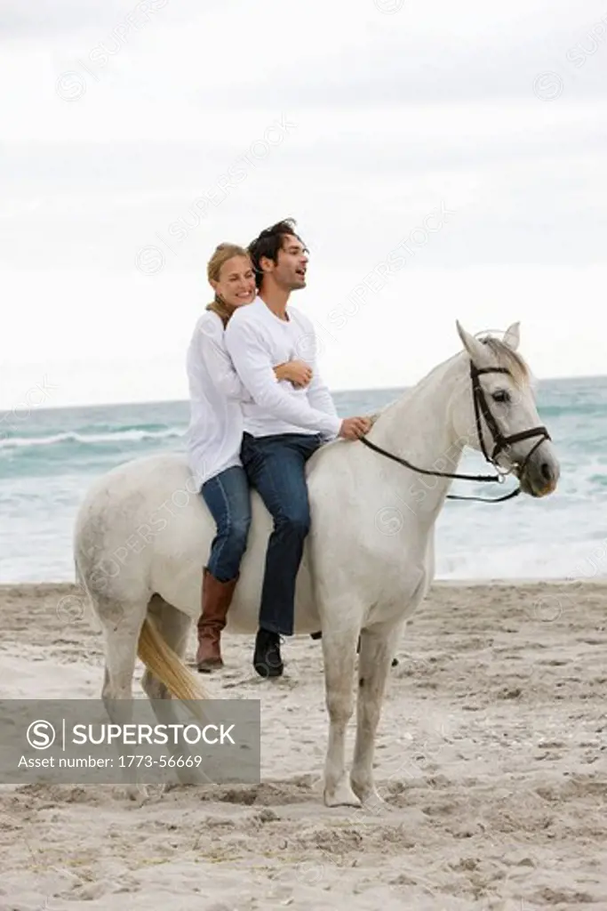 White horse, couple, sea, sand, beach