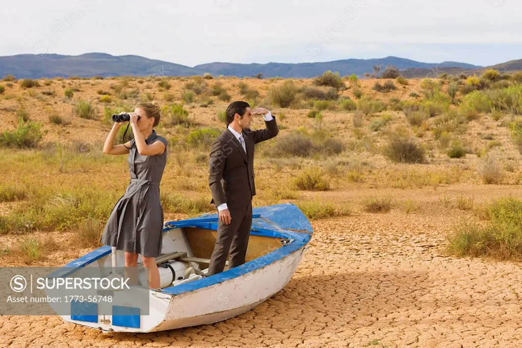 Business_couple lost in desert